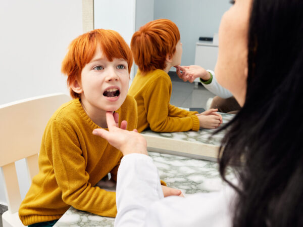 Male child in session with a speech therapist. Paediatric speech and language therapy Male child in session with a speech therapist. Paediatric speech and language therapy